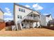 A view of the rear exterior of a home with porch and patio with backyard at 3418 Longleaf Estates Dr, Raleigh, NC 27616