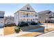 Beautiful two-story home with a welcoming front porch and a well-maintained lawn in a cozy neighborhood at 3418 Longleaf Estates Dr, Raleigh, NC 27616