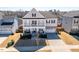 Inviting two-story home featuring a charming front porch and well-manicured landscaping in a suburban neighborhood at 3418 Longleaf Estates Dr, Raleigh, NC 27616