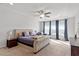 Spacious main bedroom boasts tray ceilings, plush carpet and relaxing sitting area with large windows at 3418 Longleaf Estates Dr, Raleigh, NC 27616