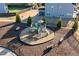 Aerial view of neighborhood playground featuring benches, slides, and a secure fence in a green and shady space at 3418 Longleaf Estates Dr, Raleigh, NC 27616