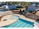 Aerial view of the community pool with splash pad, zero entry and playground in residential neighborhood at 3418 Longleaf Estates Dr, Raleigh, NC 27616