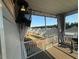 A screened in porch features a TV, curtains and a view of the neighborhood at 3418 Longleaf Estates Dr, Raleigh, NC 27616