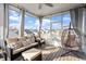 Cozy sunroom with outdoor seating and open view of neighborhood at 3418 Longleaf Estates Dr, Raleigh, NC 27616
