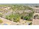 Aerial view of heavily wooded property with structures at 348 Raymond Tharrington Rd, Louisburg, NC 27549