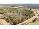 Extensive aerial view of a large, wooded parcel with a road running alongside at 348 Raymond Tharrington Rd, Louisburg, NC 27549