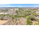 Panoramic aerial view of a rural landscape featuring open fields and dense woodlands at 348 Raymond Tharrington Rd, Louisburg, NC 27549