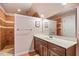 Stylish bathroom features tile accents, a vanity with storage, and a walk-in shower at 348 Raymond Tharrington Rd, Louisburg, NC 27549