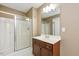 Bathroom features a shower stall, vanity with storage, and neutral color palette at 348 Raymond Tharrington Rd, Louisburg, NC 27549