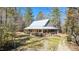 Charming home with welcoming porch and landscaped front yard at 348 Raymond Tharrington Rd, Louisburg, NC 27549