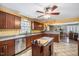 Spacious kitchen features granite countertops, stainless steel appliances, and an island at 348 Raymond Tharrington Rd, Louisburg, NC 27549