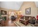 Inviting living room with a fireplace, comfortable seating, and natural light streaming in at 348 Raymond Tharrington Rd, Louisburg, NC 27549