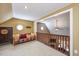 Upstairs bonus room with cozy seating area, a ceiling fan, and lots of light at 348 Raymond Tharrington Rd, Louisburg, NC 27549