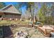 Backyard patio area with comfortable seating, fire pit, and outdoor umbrella at 348 Raymond Tharrington Rd, Louisburg, NC 27549