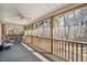Relaxing screened porch with ceiling fan overlooking wooded area at 348 Raymond Tharrington Rd, Louisburg, NC 27549