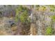 Aerial view of neighborhood with tree coverage and street access to properties at 355 Riverstone Dr, Clayton, NC 27527