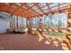 Spacious backyard deck with a pergola, outdoor seating, and a view of the woods at 355 Riverstone Dr, Clayton, NC 27527
