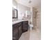 Well-appointed bathroom with granite countertops, a tiled shower, and modern fixtures at 355 Riverstone Dr, Clayton, NC 27527