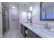 Lovely bathroom with marble counters, dual sinks, and a glass shower at 355 Riverstone Dr, Clayton, NC 27527