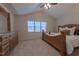 Cozy bedroom with a large bed, a dresser, plush carpet, and a window with lots of light at 355 Riverstone Dr, Clayton, NC 27527