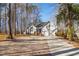 Charming single-Gathering home featuring attached garage, well-kept lawn, and long driveway at 355 Riverstone Dr, Clayton, NC 27527