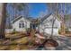 Charming one-story home featuring a well-maintained lawn, complemented by a two-car garage at 355 Riverstone Dr, Clayton, NC 27527