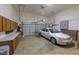 Spacious garage features built-in storage, room for parking, and garage door that opens at 355 Riverstone Dr, Clayton, NC 27527