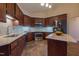 Stylish kitchen with stainless steel appliances, granite countertops, tile backsplash, and ample storage at 355 Riverstone Dr, Clayton, NC 27527