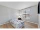 Bedroom featuring light wood floors, large window, and neutral paint at 3803 Chimney Ridge Pl # 102, Durham, NC 27713