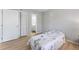 Bedroom with light wood floors, closet, and view into the en-suite bathroom at 3803 Chimney Ridge Pl # 102, Durham, NC 27713