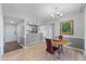 Dining room with pendant lighting, gray and white paint, and new flooring at 3803 Chimney Ridge Pl # 102, Durham, NC 27713