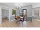 Dining area with updated lighting, new flooring, and sliding glass doors to patio at 3803 Chimney Ridge Pl # 102, Durham, NC 27713