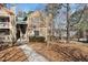Attractive townhouse with mulched lawn, walkway, steps, and an outdoor porch at 3803 Chimney Ridge Pl # 102, Durham, NC 27713