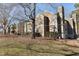 Exterior view of townhome building featuring a green roof and tree at 3803 Chimney Ridge Pl # 102, Durham, NC 27713