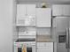 Bright kitchen with white cabinets, granite countertops, and stainless steel refrigerator at 3803 Chimney Ridge Pl # 102, Durham, NC 27713