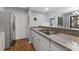 Open concept kitchen features granite counters, stainless sink, and views of living areas at 3803 Chimney Ridge Pl # 102, Durham, NC 27713