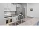 Well-lit kitchen with granite counters, stainless steel appliances, and double basin sink at 3803 Chimney Ridge Pl # 102, Durham, NC 27713