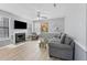 Living room with a fireplace, large TV, neutral paint and new flooring at 3803 Chimney Ridge Pl # 102, Durham, NC 27713