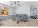 Cozy living room features new flooring, neutral paint, and a ceiling fan at 3803 Chimney Ridge Pl # 102, Durham, NC 27713