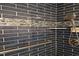 Detail of shower with blue subway tile, decorative accent tile, and grab bar at 3803 Chimney Ridge Pl # 102, Durham, NC 27713