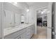 Bright bathroom featuring double vanities, granite countertops, and views of a nearby bedroom at 3805 Barberry Lake Ct, Fuquay Varina, NC 27526