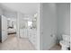 Bright bathroom featuring double vanity, neutral tile and views to bedroom at 3805 Barberry Lake Ct, Fuquay Varina, NC 27526