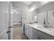 Bathroom featuring double vanities, granite countertops, and views of the main bedroom at 3805 Barberry Lake Ct, Fuquay Varina, NC 27526