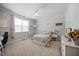 Neutral bedroom with ceiling fan, natural light, and light gray walls at 3805 Barberry Lake Ct, Fuquay Varina, NC 27526
