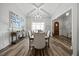 Elegant dining room with modern lighting and hardwood flooring at 3805 Barberry Lake Ct, Fuquay Varina, NC 27526