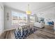 Inviting dining room with natural light, table, chairs, and views to the living room at 3805 Barberry Lake Ct, Fuquay Varina, NC 27526