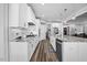 Elegant kitchen features stainless steel appliances, granite counters, white cabinets, and open layout at 3805 Barberry Lake Ct, Fuquay Varina, NC 27526