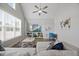 Cozy living area with high ceiling, sectional sofa, built-in shelving, and natural light at 3805 Barberry Lake Ct, Fuquay Varina, NC 27526