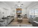The living room features a stone fireplace, ceiling fan, and hardwood floors at 3805 Barberry Lake Ct, Fuquay Varina, NC 27526