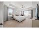 Spacious main bedroom features large windows, tray ceiling, and plush carpeting at 3805 Barberry Lake Ct, Fuquay Varina, NC 27526